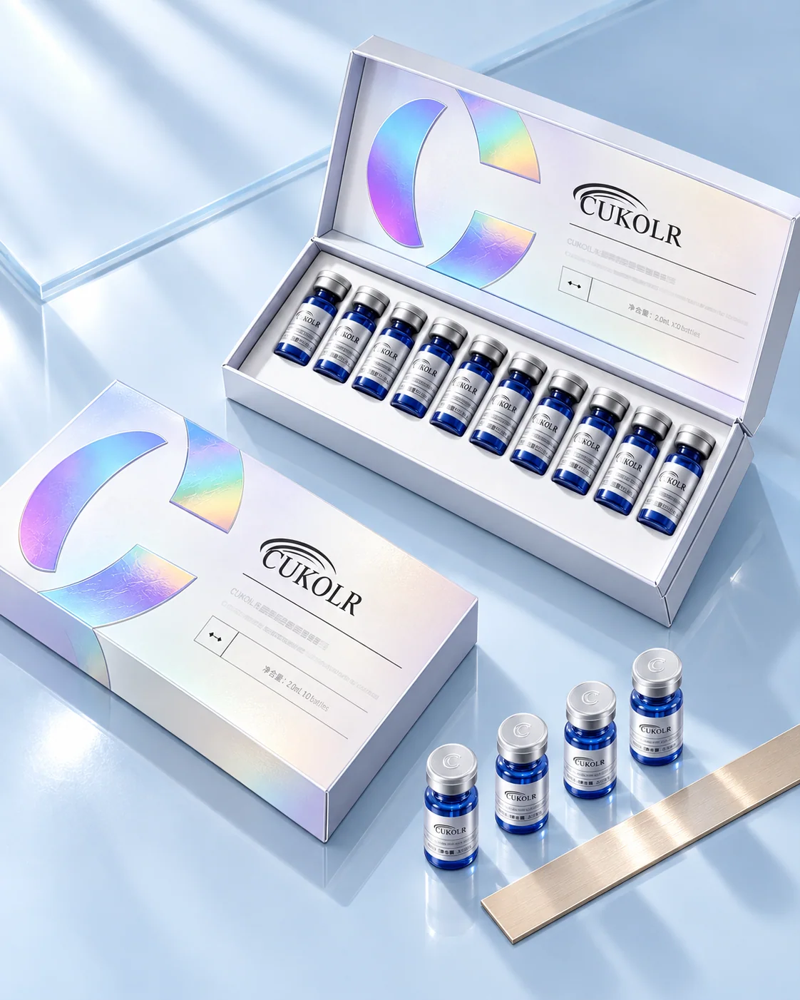 Two CUKOLR presentation boxes on a pale blue surface