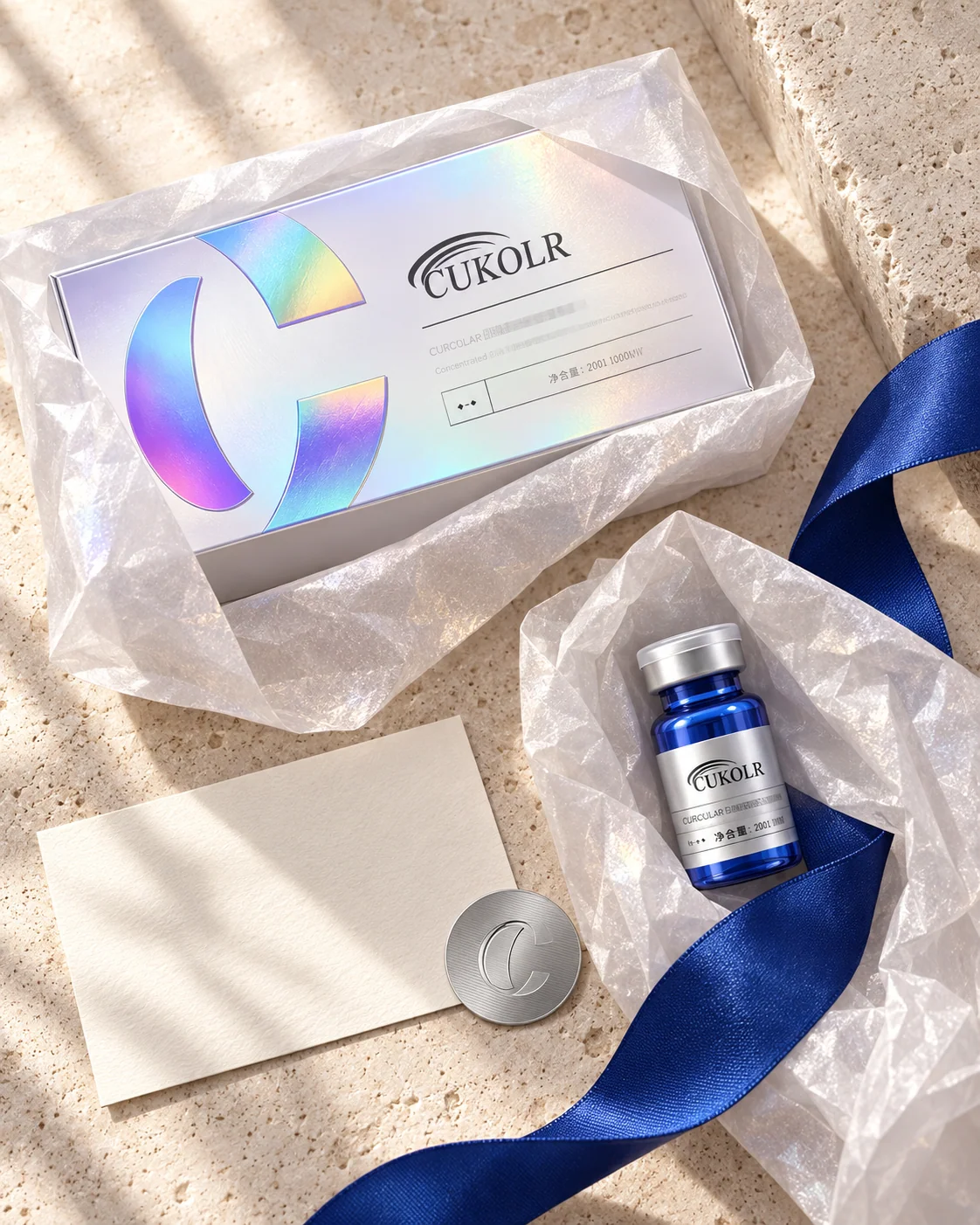 CUKOLR gift box, blue vial and cobalt ribbon