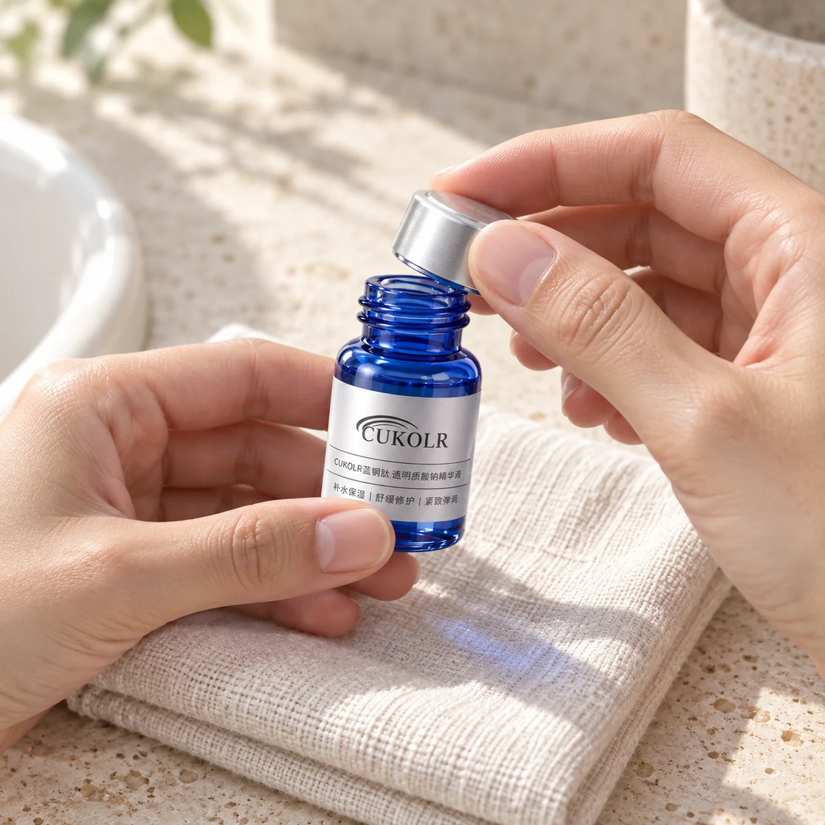 Hands opening one ampoule